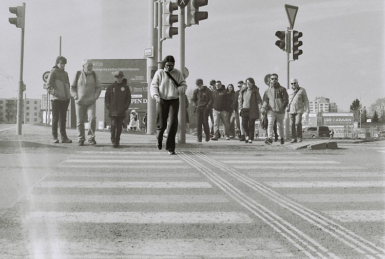 One step ahead of the world behind her